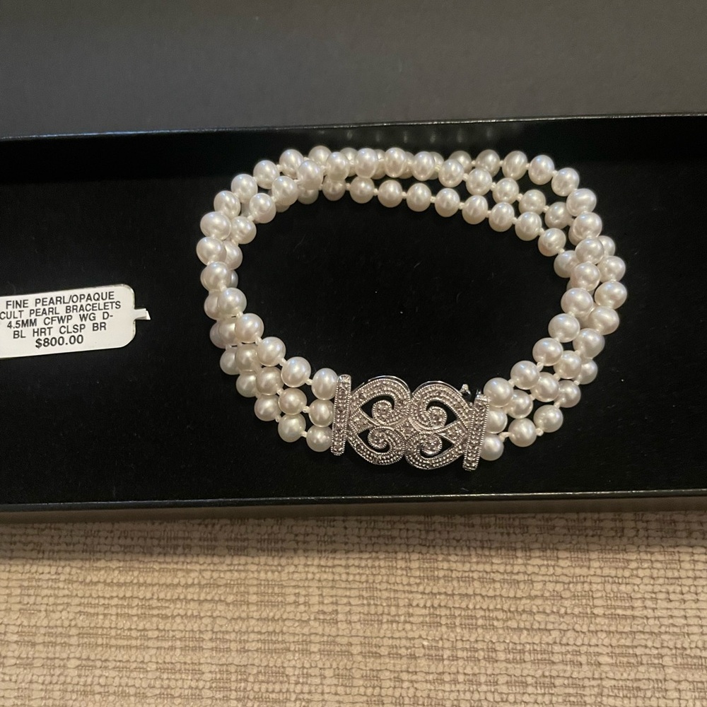 Authentic pearl, white gold, and diamond bracelet